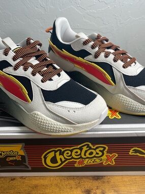 Puma Cheetos RS-X Sneakers in Black, White, Red, Yellow and Brown